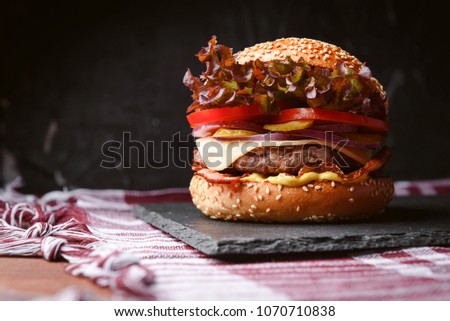 juicy and fresh classic burger with a large beef chop