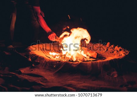 Long exposure picture of a bonfire on the beach, Long Beach, Ko Lanta, Thailand.