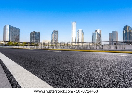 empty asphalt road with modern building in suzhou china