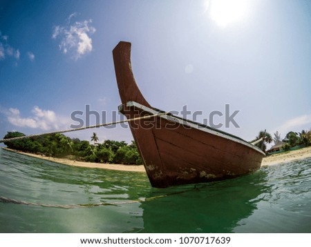 Action cam fisheye picture of a traditional thai longtail boat in Long Beach, Ko Lanta, Thailand
