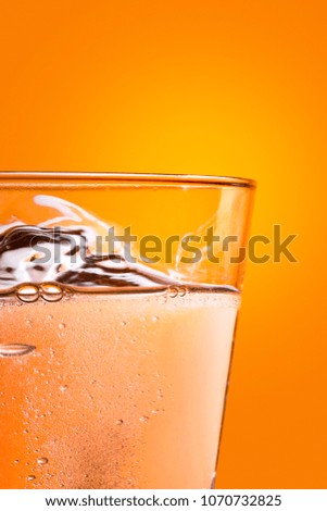 Effervescence tablet dissolving on a glass of water