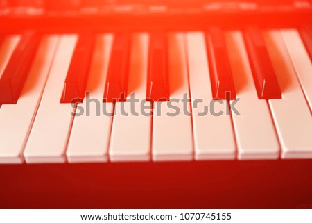 Keys of a black and white color of a piano close up