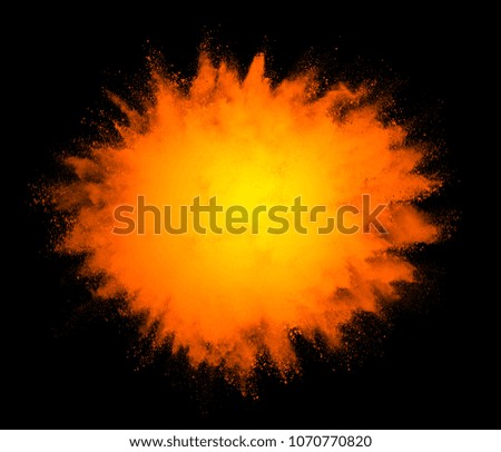 Freeze motion of colored powder explosions isolated on black background