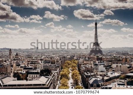 Panoramic view of capital of France Paris with Eiffel tower from above, beautiful cityscape, cloudy blue sky. Day with wonderful historical landsmark and builduings. Nice attractive city for tourists Royalty-Free Stock Photo #1070799674