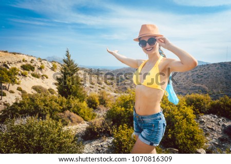 Woman tourist in front of southern European landscape in her vacation