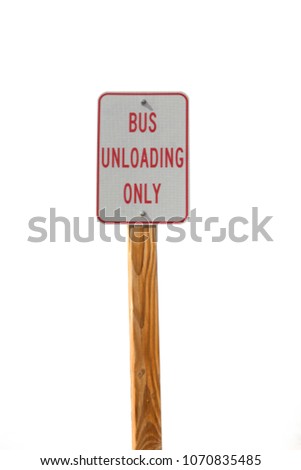 Bus unloading only sign with wood post isolated on white background.