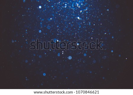 Abstract blue bokeh with black background