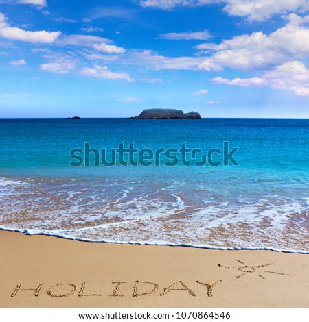 HOLIDAY insctiption under the sun drawing on wet beach sand with the turquoisesea and the island on background. Summer season  vacation concept.