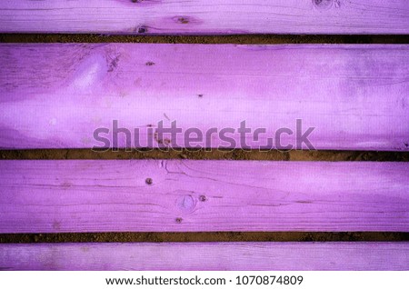Background of purple wooden planks. Close-up.