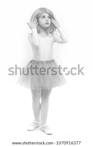Small girl t in pink skirt. beauty and fashion. Childhood and happiness. Child in wig isolated on white background. ballet and art.
