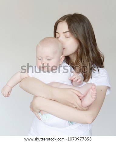
funny portrait of baby and mom