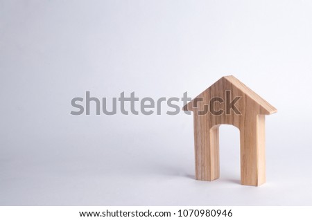 Wooden house with a large doorway on a white background. The concept of buying and selling real estate, rental housing. 