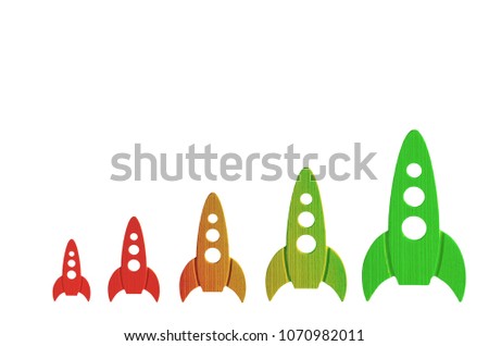 Rockets color from red to green are in order of increasing on a white background. The concept of space and technology, travel to the stars and other planets. Space tourism. Launch of spaceships
