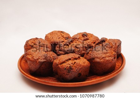 Chocolate cupcakes with poppy seeds and raisins