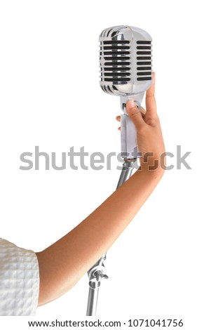 Girl hands holding microphone. Old style classic isolated on white background. This hs clipping path.