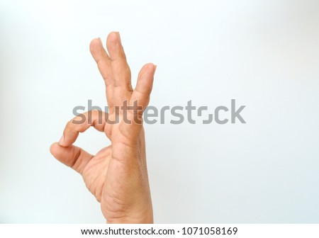 Hand OK sign on white background