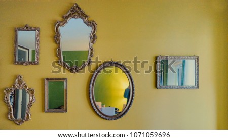 Vintage mirrors on the wall. Film noise effect. 