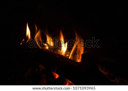 Fire in a fireplace.