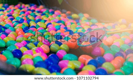 Blurry plastic egg for lapping egg game.  It occur in festival for children.
