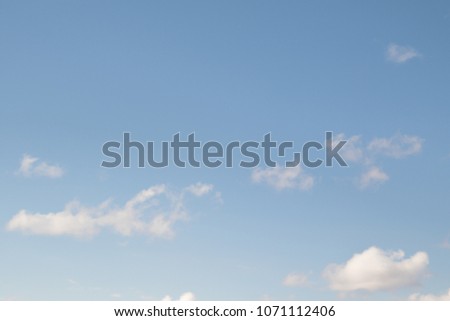 white clouds on a blue sky day
