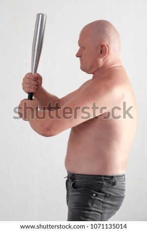 bald, angry eldery criminal man with baseball bat