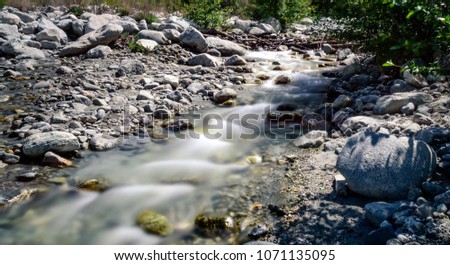 A small mountain creek in the southern california mountains.  Long Exposures smooth the water over the rocks.