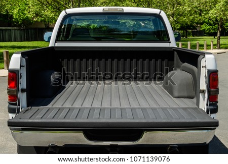 White Truck Bed, empty bad of an modern white truck, daylight Royalty-Free Stock Photo #1071139076