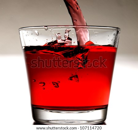 Pouring red cocktail