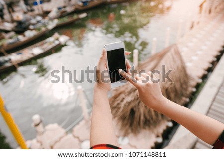 Woman using cellphone at outdoor