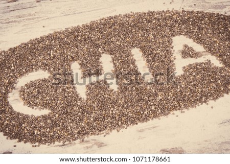 Vintage photo, Inscription chia and heap of seeds, concept of healthy food containing natural vitamins, minerals and dietary fiber