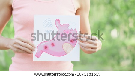 woman with stomach billboard on the green background