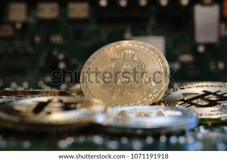 Bitcoin on the electric board - photography - new gold - golden and silver bitcoin