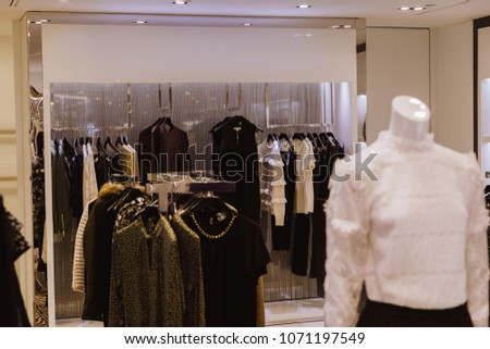 Interior of brand new fashion clothes store. Milan Italy
