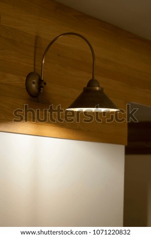 metal brass light fixture fixed on the wall