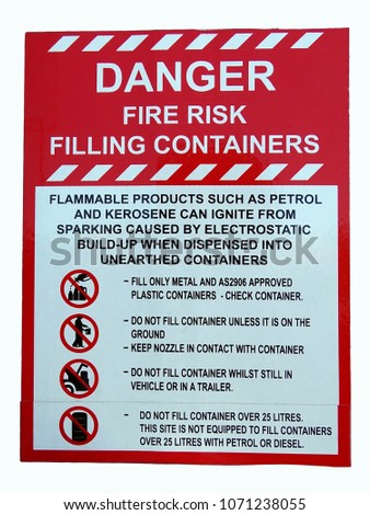 A sign showing danger of fire risk when filing containers with petrol or kerosene
