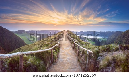 Mountain landscape with hiking trail and view of beautiful lakes Ponta Delgada, Sao Miguel Island, Azores, Portugal. Royalty-Free Stock Photo #1071252569
