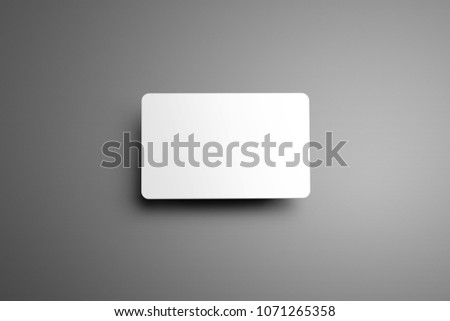 Universal blank mockup  one bank (gift) card with shadows on a gray background. Top of view. 
