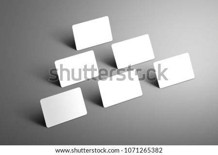 Universal  mockup of six  bank gift cards arranged in a triangle with shadows  on a gray  background. Ready to used in your design. 