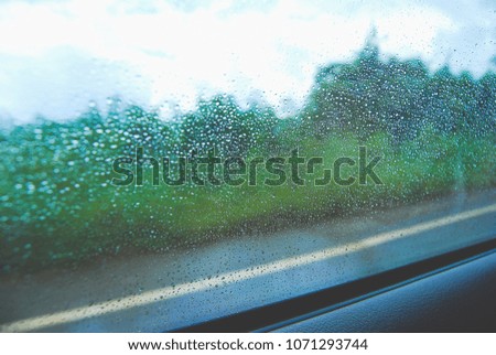 view image water drop at car glass,  raining time