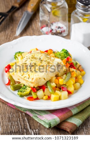 White fish fillet with vegetable stew, cod, sea bass, tilapia, perch, corn, broccoli, potatoes, bell peppers, beans, healthy food, delicious homemade lunch