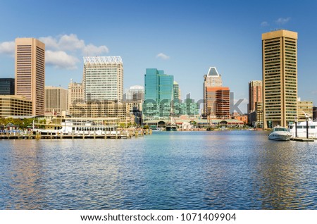 View of Baltimore Skyline and Waterfront under Blue Sky on a Sunny Fall Day. Maryland, USA.
