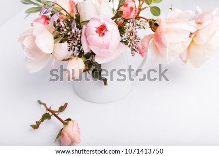 Festive flower English rose composition on the white background. Overhead top view, flat lay. Copy space. Birthday, Mother's, Valentines, Women's, Wedding Day concept.