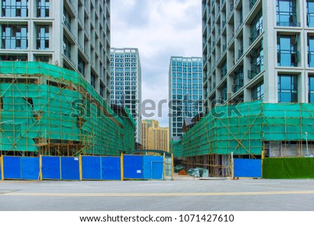 Upcoming building skyscrapers at construction site