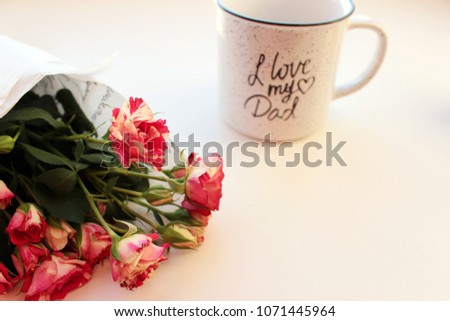 Father's Day greeting concept with red roses and cup I love my Dad, isolated.	