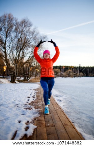 Picture of young athlete girl on morning exercise in winter