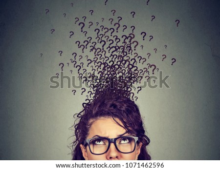 Young woman with too many questions and no answer Royalty-Free Stock Photo #1071462596