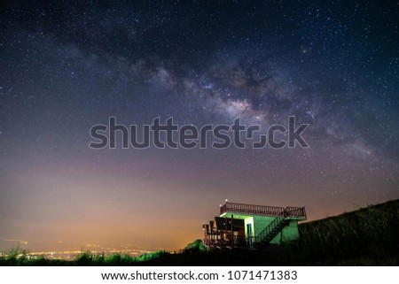 night landscape mountain and green hut milky way  galaxy background , thailand , long exposure , low light 