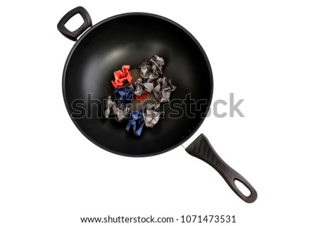 Black pan with white backdrop.