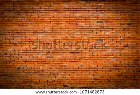 The background of the brick wall is beautifully arranged. Ancient brick wall Grunge background The backdrop may be used in interior design.