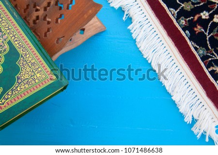  Islamic conceptual background image with empty space and  Islamic book on the blue table. 